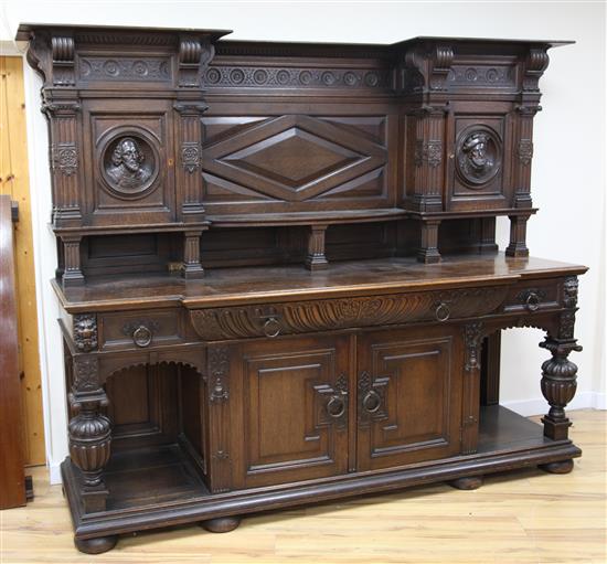 A late 19th century large carved oak breakfront sideboard, W.7ft 9in.
